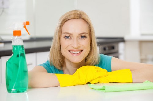 Cleaner handling equipment safely during routine cleaning tasks