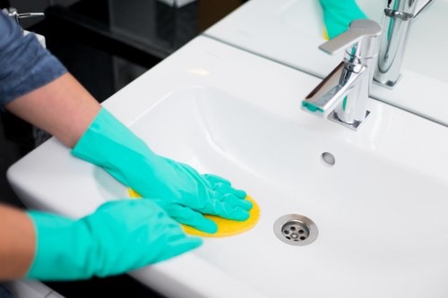 Local cleaning team working in a shared residential corridor in Harringay