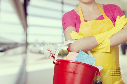 Local cleaner tidying a flat in Harringay