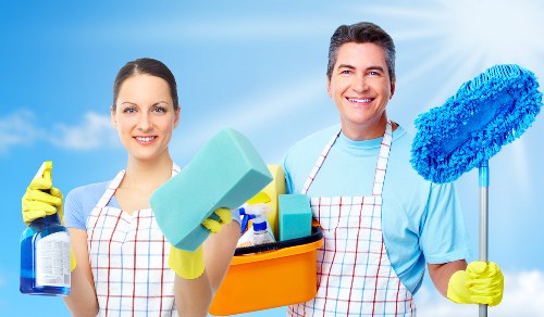 Local upholstery cleaner treating a living room sofa near Green Lanes